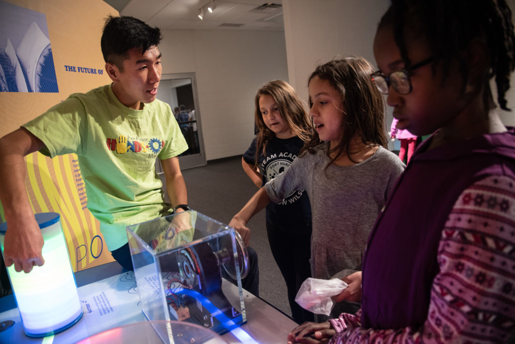 Young students shown engaging with wind exhibit in Experience Center