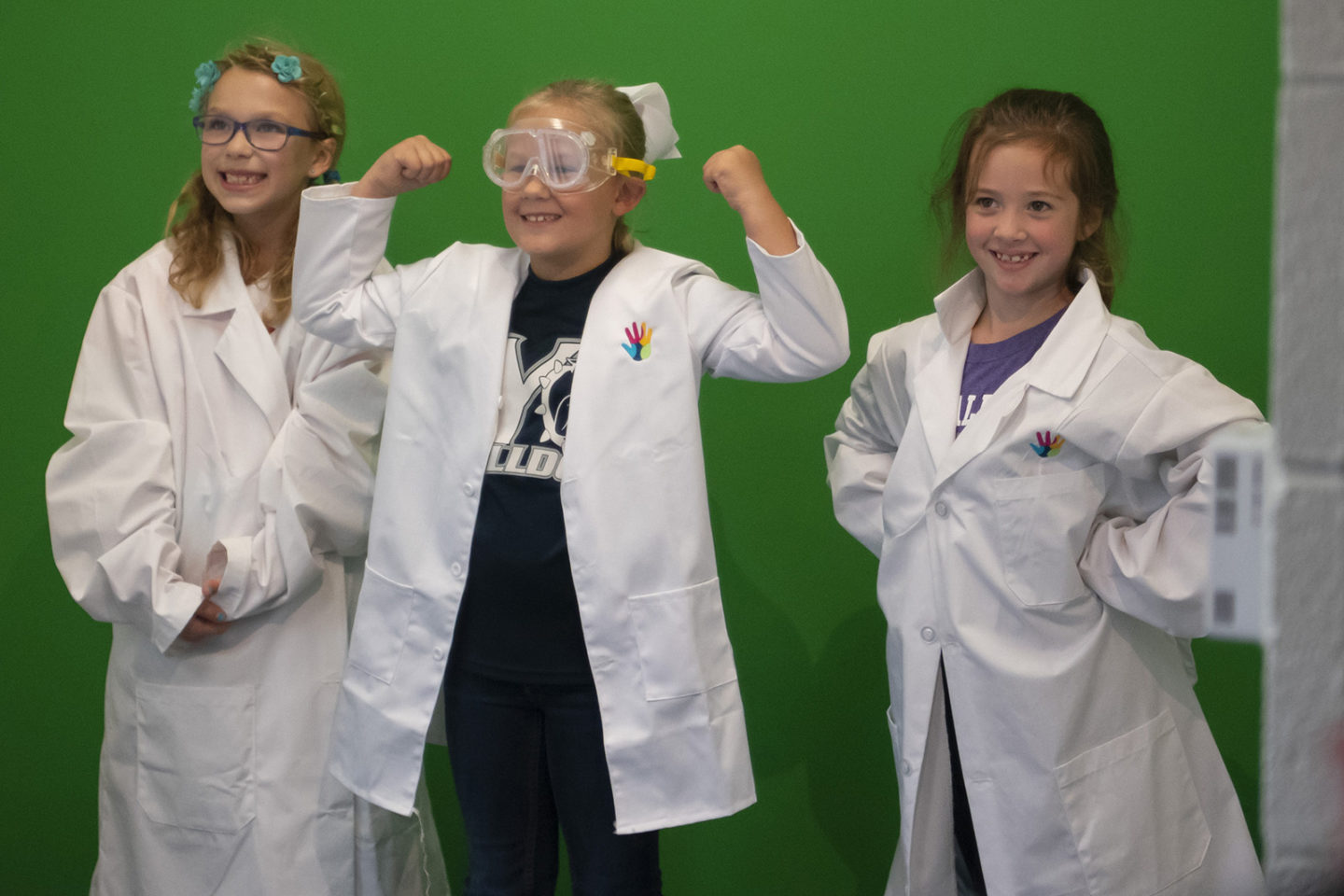 Three young students in the experience center
