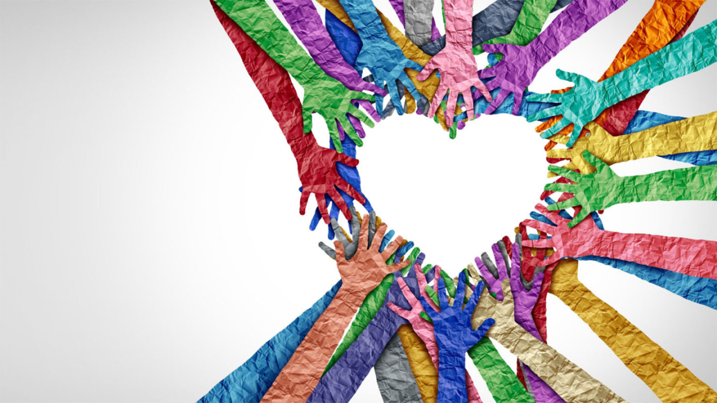 multicolored hands forming a heart