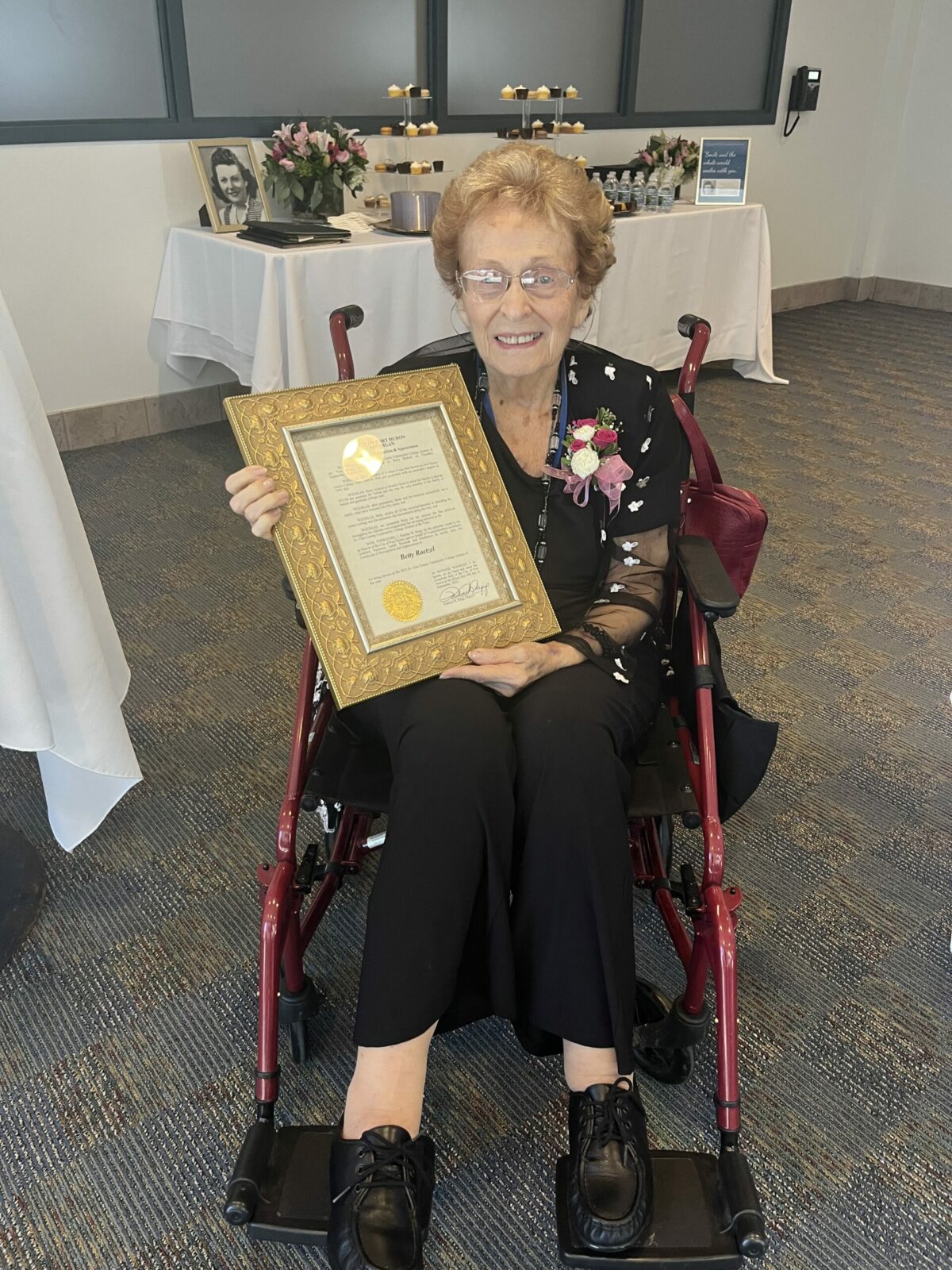 Betty M. (Large) Raetzel pictured with award.