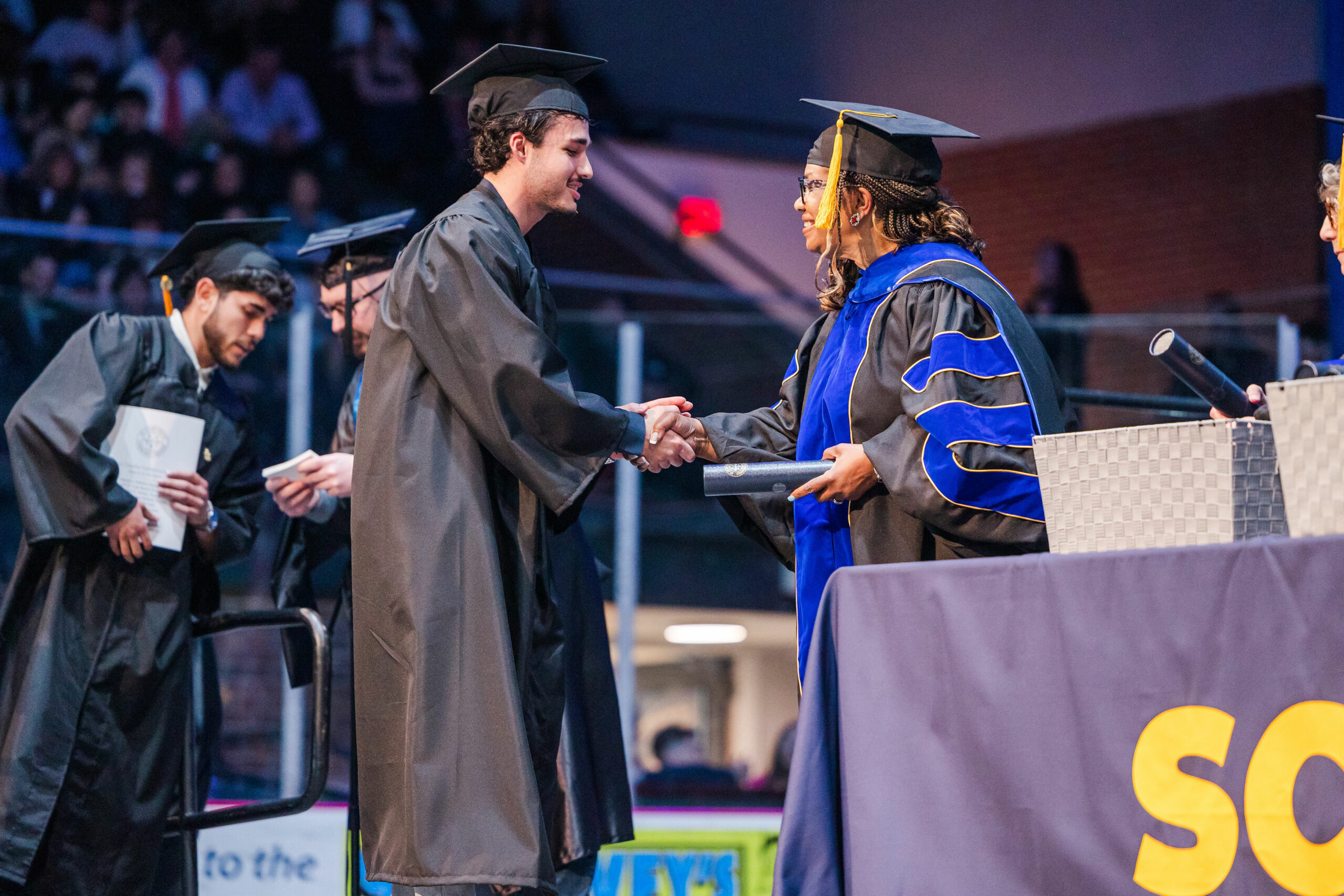 Student receiving diploma at commencement
