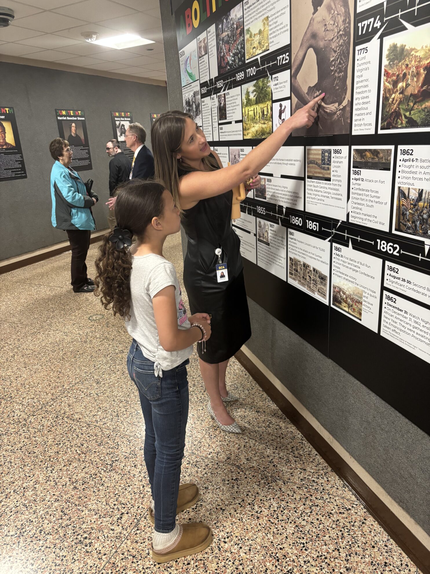 Someone showing child artwork