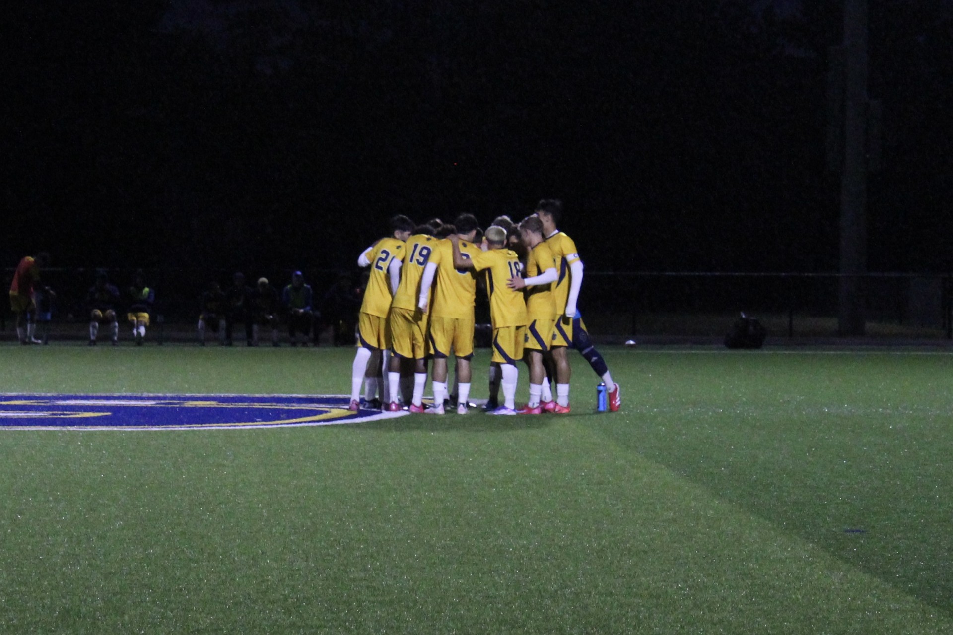 SC4 soccer team in a huddle